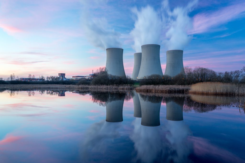 nuclear power plant chimneys at dusk